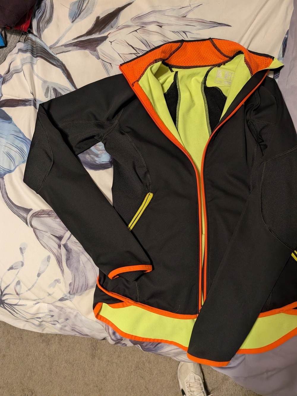New Balance Black Jacket with Neon Yellow Lining and Orange Trim